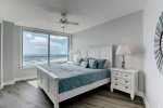 Primary Bedroom features king size bed, flat screen tv, beach views and balcony access.